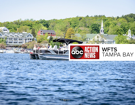 A serene lake scene with boats, houses, and a church against a backdrop of trees, overlaid by an ABC Action News WFTS Tampa Bay logo and text.